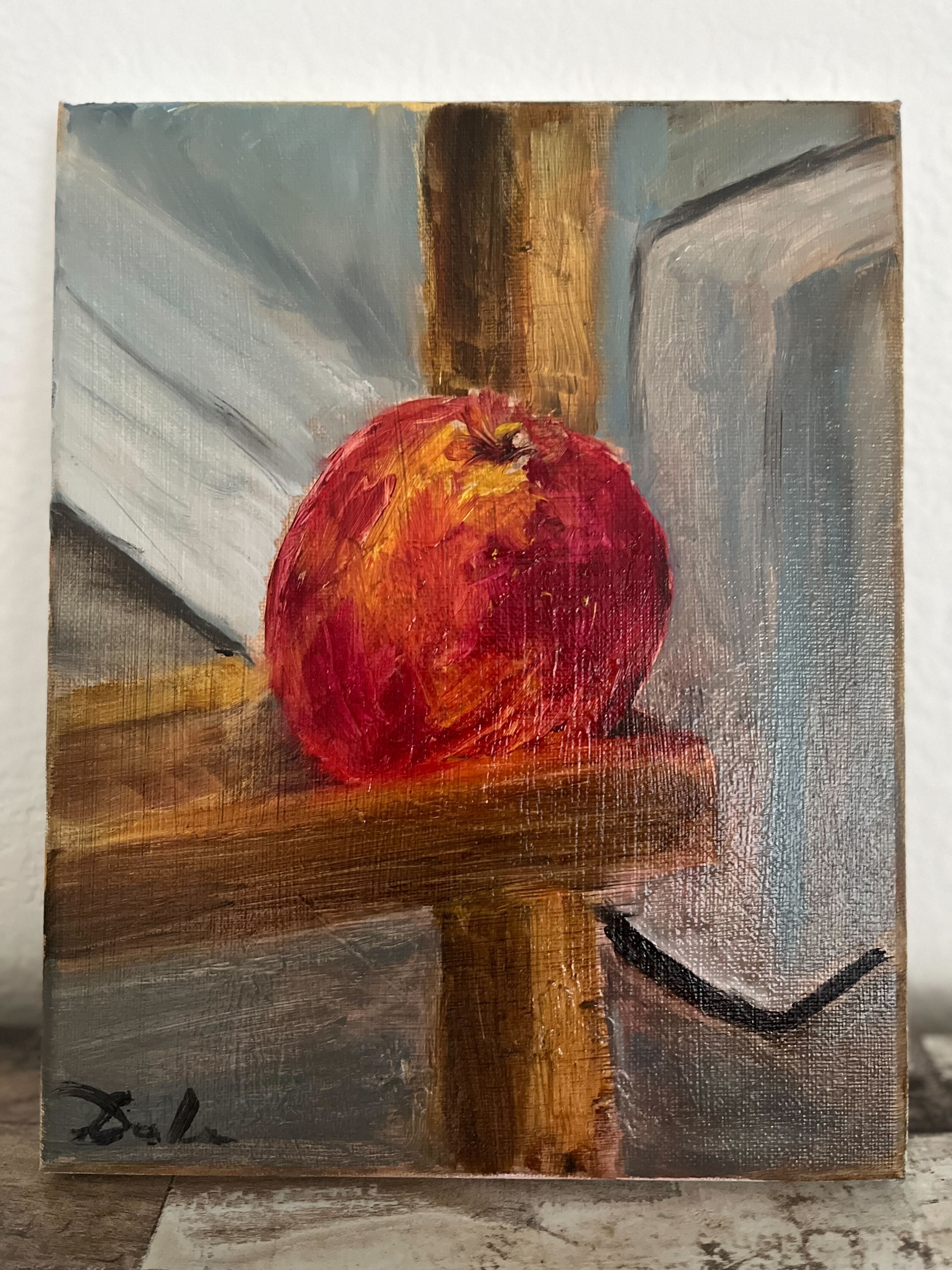 Red apple on easel