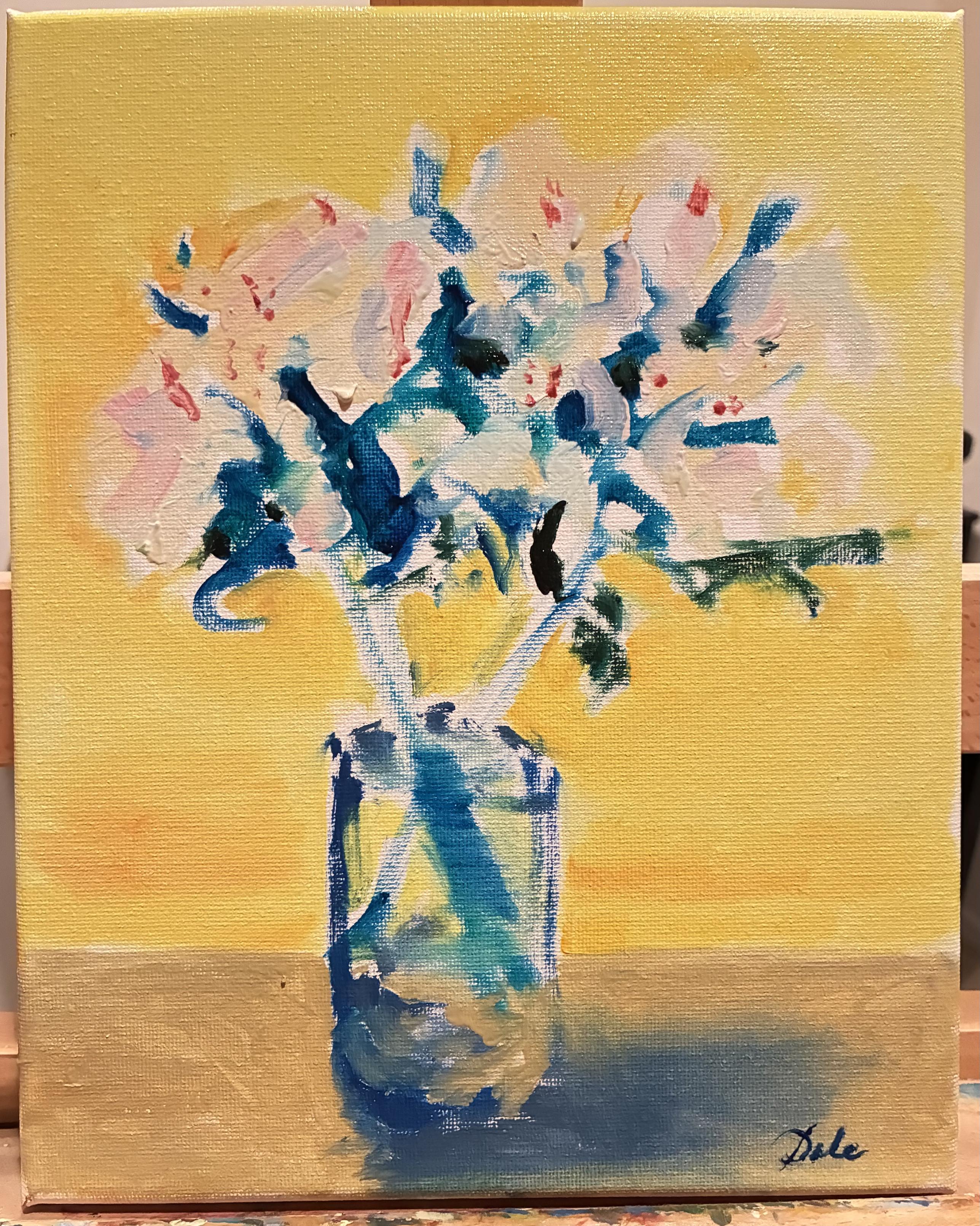 Pale flowers in a glass vase